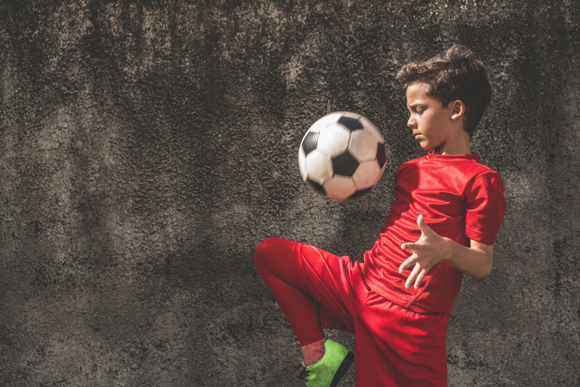Skilled boy playing football